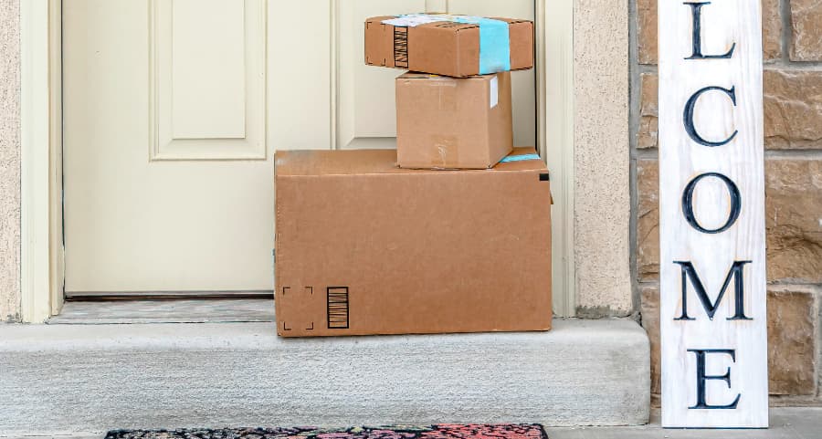 Deliveries on the front porch of a house with a welcome sign in Jefferson City